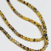 Amber and Black Glass Rounds with Irridescent Finish - 800 Pieces