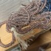 One dozen strands rose/goldstone, with clear casing. 6mm round India glass