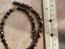 Small oval tigers eye beads-15.5” strand