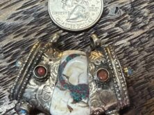 Buddhist conch shell pendant